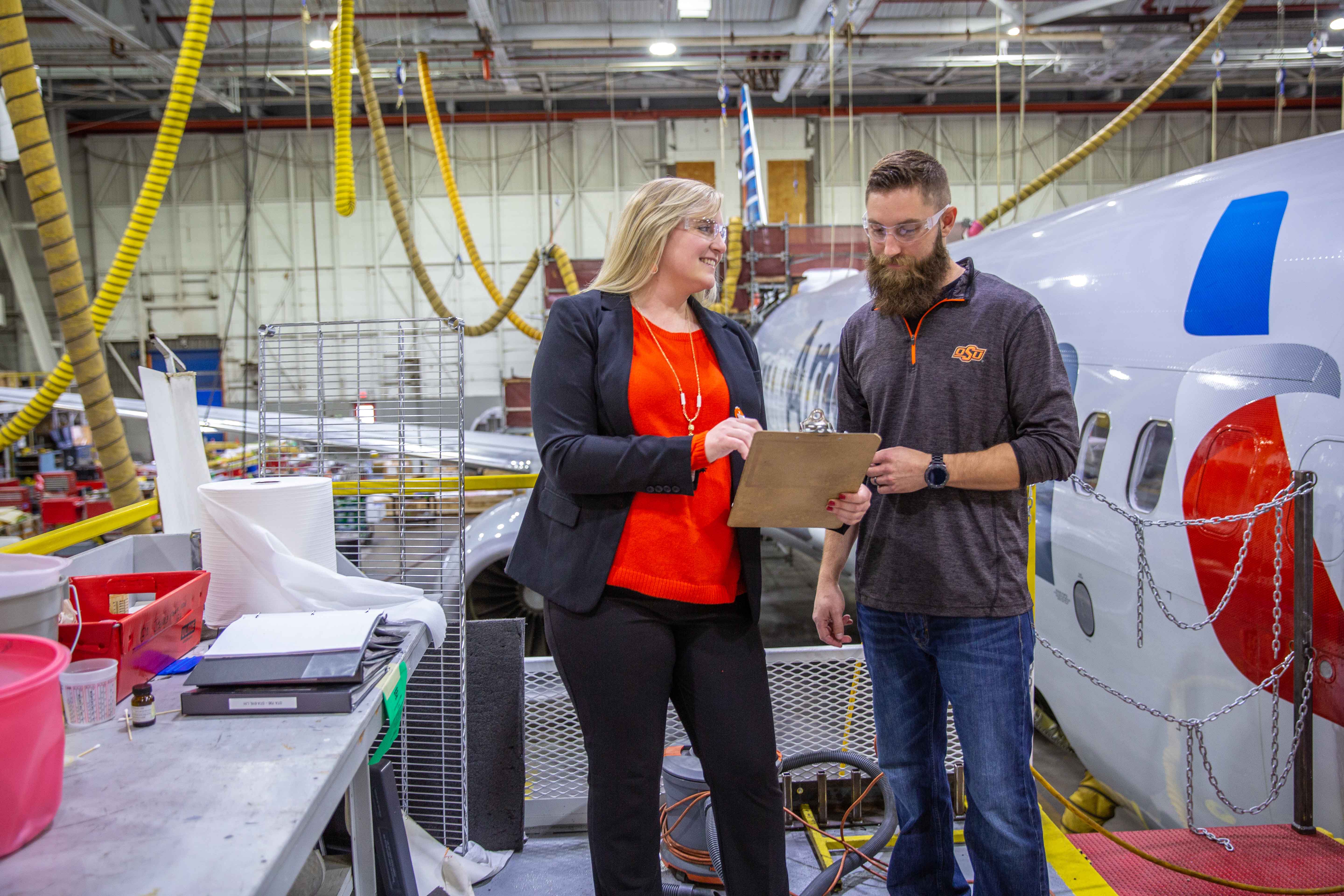working in front of plane