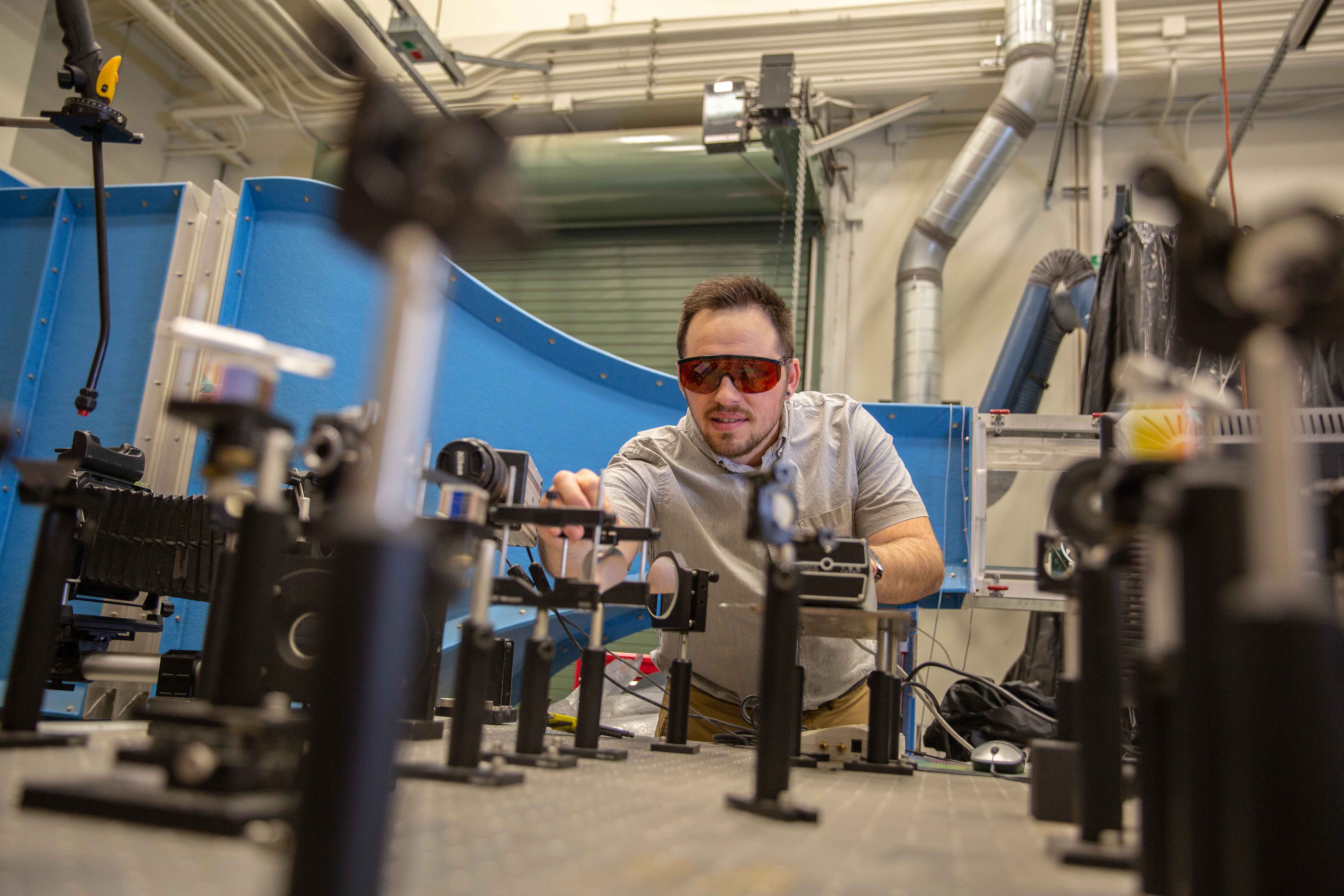 Engineer working with lasers