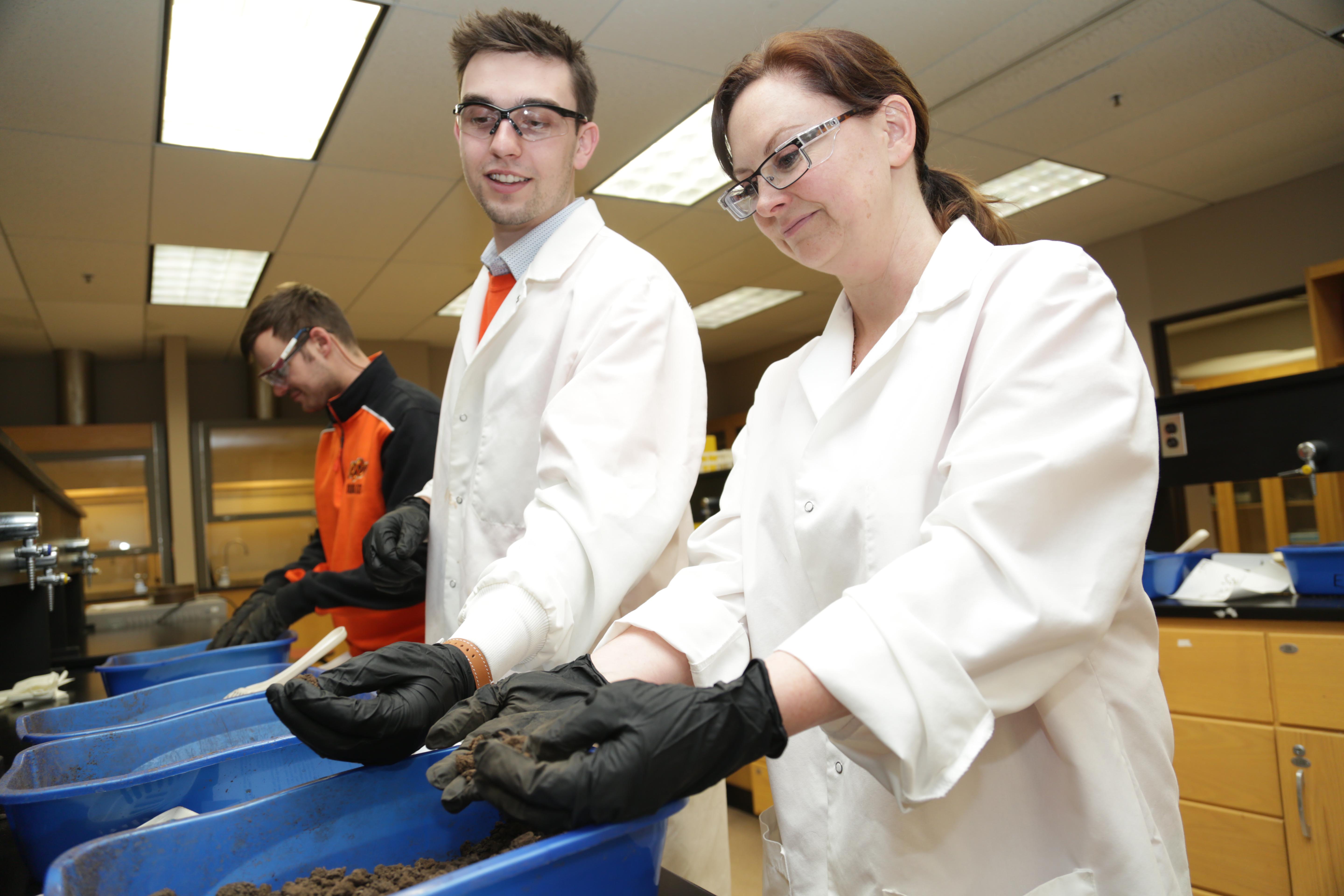 Professional Science Master's Environmental Science students work in the lab.